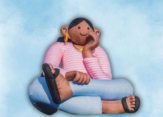 AN INDONESIAN ARTIST JUST PUT A 20-FOOT DAYDREAMER ON A BRUSSELS CANAL, AND BELGIUM CAN'T STOP LOOKING